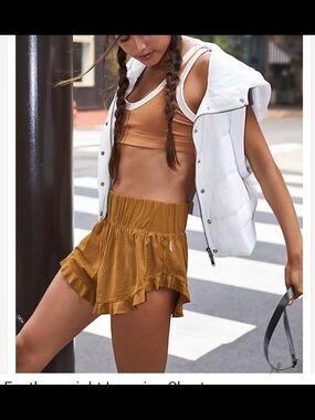 Free People Movement Ruffled Active Shorts in Mustard